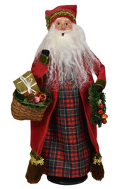 Traditional Santa Claus figure with a plaid skirt, red coat, and white beard holding a gift and basket.