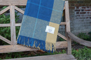 Tartan Blanket outdoors in garden on bench close up