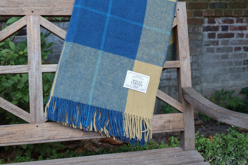 Tartan Blanket outdoors in garden on bench close up